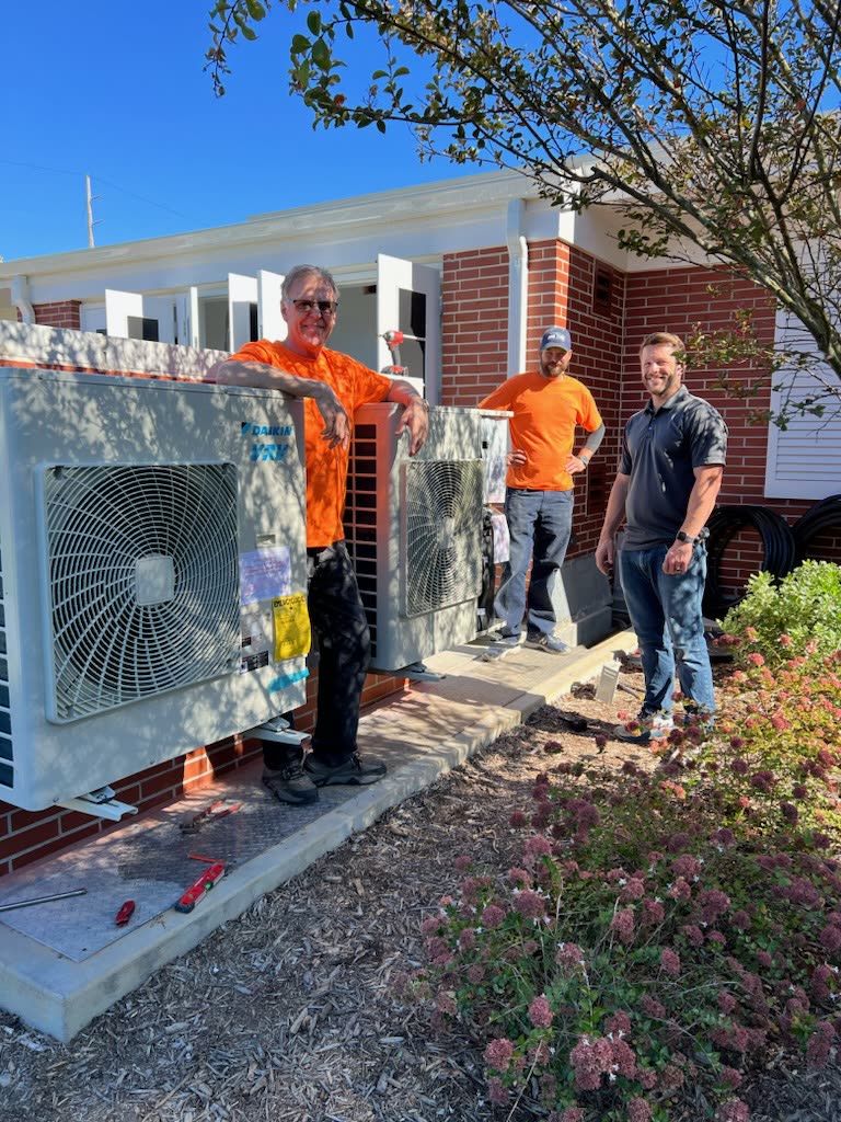 The Metalsmiths team installing a Daikin VRV heat pump system