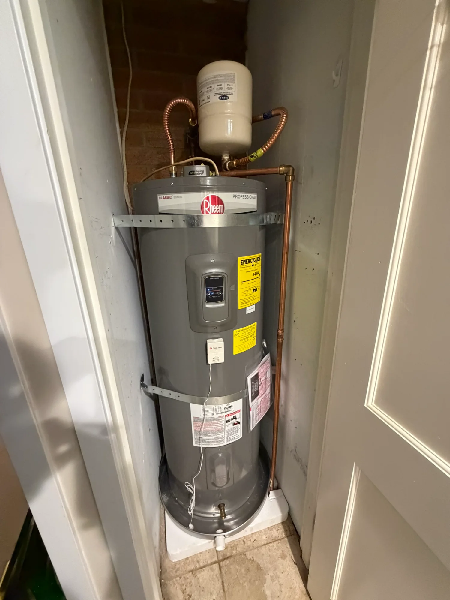 Professional Rheem water heater installation with expansion tank
